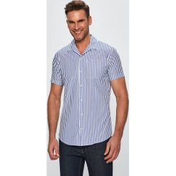 Jack & Jones - Koszula. Niebieskie koszule męskie Jack & Jones, s, bez wzorów, z bawełny, klasyczne, z klasycznym kołnierzykiem, z krótkim rękawem. W wyprzedaży za 69,90 zł.