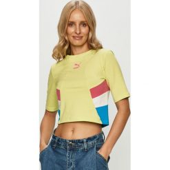 Puma - T-shirt. Żółte topy damskie Puma, s, z nadrukiem, z elastanu, z krótkim rękawem. Za 139,90 zł.