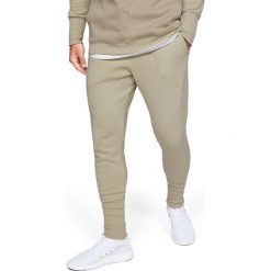 Under Armour Baseline Spodnie dresowe Żółty Brązowy. Żółte spodnie męskie Under Armour, s, bez wzorów, z bawełny. Za 309,95 zł.