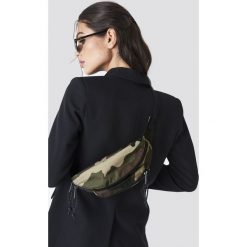 Eastpak Torba Doggy - Green,Multicolor. Zielone torebki klasyczne damskie marki Eastpak, w paski, z poliesteru, małe. Za 121,95 zł.