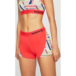 Reebok - Szorty. Pomarańczowe spodenki sportowe damskie Reebok, m, bez wzorów, z elastanu, sportowe. W wyprzedaży za 59,90 zł.