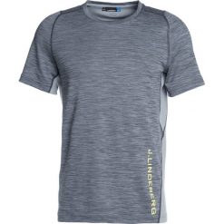 J.LINDEBERG SANDY Tshirt z nadrukiem grey melange. Szare topy sportowe damskie marki J.LINDEBERG, m, z nadrukiem, z poliesteru. Za 249,00 zł.