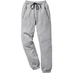 Spodnie dresowe Slim Fit bonprix jasnoszary melanż. Szare rurki męskie bonprix, z aplikacjami, z dresówki. Za 89,99 zł.