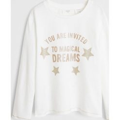 Mango Kids - Longsleeve dziecięcy Magical 110-164 cm. Białe bluzki dziewczęce Mango Kids, z nadrukiem, z bawełny, z okrągłym kołnierzem, z krótkim rękawem, krótkie, bez kaptura. Za 49,90 zł.