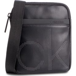 Saszetka CALVIN KLEIN - Ck Up Mini Flat Crossover K50K504353 001. Czarne torby męskie skórzane marki Calvin Klein, bez wzorów, ze skóry ekologicznej, młodzieżowe. Za 299,00 zł.