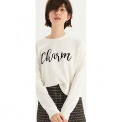 Bluza z połyskującym napisem - Kremowy. Białe bluzy damskie marki Sinsay, l, z napisami. Za 39,99 zł.
