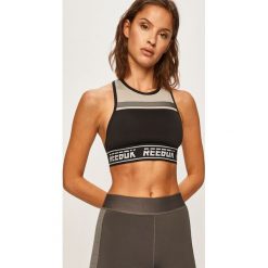 Reebok - Biustonosz sportowy. Czarne biustonosze sportowe damskie Reebok, s, z nadrukiem, z elastanu. W wyprzedaży za 99,90 zł.