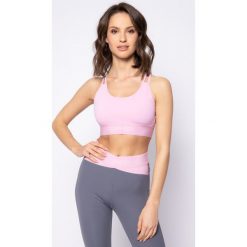 Biustonosz top Calvin Klein Performance Medium Support Sports Bra 00GWS0K174. Różowe topy damskie Calvin Klein Performance, s, bez wzorów, z elastanu, bez kołnierzyka. W wyprzedaży za 219,00 zł.