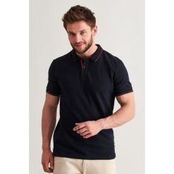 Koszulka polo w kolorze granatowym. Niebieskie koszulki męskie TATUUM, s, bez wzorów, z bawełny, polo, bez rękawów. W wyprzedaży za 64,95 zł.