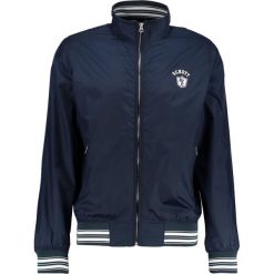 Schott NYC Kurtka wiosenna navy. Niebieskie t-shirty męskie marki Schott NYC, m, z materiału. W wyprzedaży za 395,10 zł.