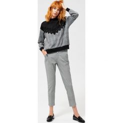 Spodnie w pepitkę. Czarne spodnie damskie Moodo, xl, z elastanu. Za 39,99 zł.
