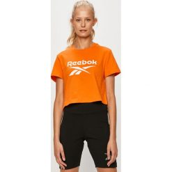 Reebok Classic - T-shirt. Pomarańczowe topy damskie Reebok Classic, s, z nadrukiem, z elastanu, z krótkim rękawem. Za 79,90 zł.