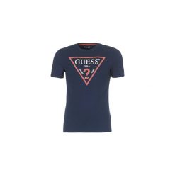 T-shirty z krótkim rękawem Guess FIRMIA. Niebieskie t-shirty męskie marki Guess, xs, z aplikacjami, bez kołnierzyka, krótkie. Za 103,20 zł.