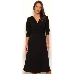 Sukienka "Jeanne" w kolorze czarnym. Czarne sukienki damskie Manoukian, s, midi, kopertowe. W wyprzedaży za 109,95 zł.