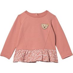 Bluza w kolorze łososiowym. Różowe bluzy niemowlęce Steiff, z aplikacjami, bez rękawów, bez kaptura. W wyprzedaży za 58,95 zł.