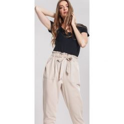 Beżowe Spodnie Danceable. Brązowe spodnie damskie other, s, z tkaniny. Za 79,99 zł.
