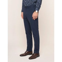 Spodnie materiałowe MICHAEL Michael Kors CS93CKL3DR. Niebieskie jeansy męskie MICHAEL Michael Kors, m, bez wzorów, z elastanu. W wyprzedaży za 229,00 zł.