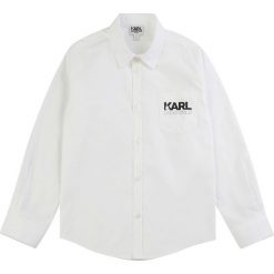 Karl Lagerfeld - Koszula dziecięca 126-150 cm. Białe koszule chłopięce KARL LAGERFELD, bez wzorów, z bawełny, casualowe, bez kołnierzyka, z długim rękawem, długie. W wyprzedaży za 219,90 zł.
