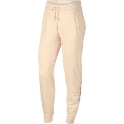 Nike Rally Spodnie dresowe Beżowy. Brązowe spodnie damskie Nike, l, z bawełny. Za 163,95 zł.