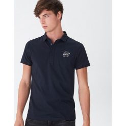Koszulka polo NASA - Granatowy. Niebieskie koszulki polo męskie House, s, bez wzorów, bez rękawów. Za 49,99 zł.