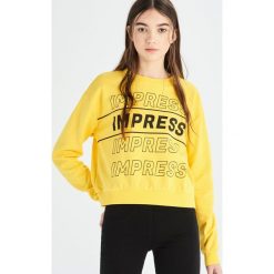 Bluza Impress - Żółty. Żółte bluzy damskie marki Sinsay, xl, bez wzorów, bez rękawów, bez kaptura. Za 29,99 zł.