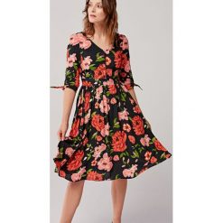 Sukienka Odette Amabilia 44 czerwony. Czerwone sukienki damskie s, w paski, z elastanu. Za 597,00 zł.