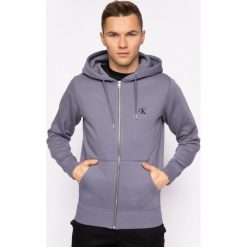 Bluza Calvin Klein Jeans Essential J30J314535. Niebieskie bluzy męskie Calvin Klein Jeans, m, bez wzorów, z bawełny, bez kołnierzyka, bez rękawów, bez kaptura. W wyprzedaży za 349,00 zł.