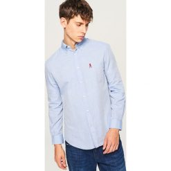 Koszula regular fit - Niebieski. Niebieskie koszule męskie marki Reserved, l. W wyprzedaży za 49,99 zł.