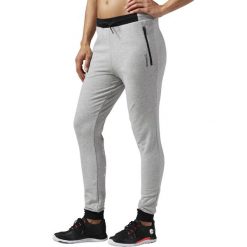 SPODNIE REEBOK WORKOUT TRACKPANTS AJ7410. Szare spodnie damskie marki Reebok. Za 89,00 zł.