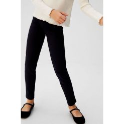 Mango Kids - Legginsy dziecięce Romavel 110-164 cm. Czarne spodnie dziewczęce Mango Kids, bez wzorów, z elastanu. Za 69,90 zł.