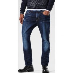 G-Star Raw - Jeansy 3301 Tapered. Niebieskie jeansy męskie G-Star RAW, z aplikacjami, retro. W wyprzedaży za 149,90 zł.