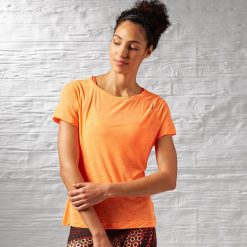 Topy sportowe damskie: Reebok Koszulka damska Work Out Ready Slub textured Tee pomarańczowa r. XS (AJ3422)