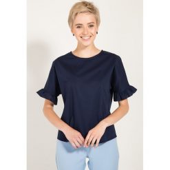 Bluzka w kolorze niebieskim. Niebieskie bluzki damskie Bessa, Moonlight, bez wzorów, z okrągłym kołnierzem, bez rękawów. W wyprzedaży za 112,95 zł.