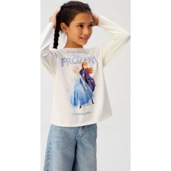 Mango Kids - Longsleeve dziecięcy Ana 110-152 cm. Białe bluzki dziewczęce Mango Kids, z nadrukiem, z bawełny, z okrągłym kołnierzem, z krótkim rękawem, krótkie, bez kaptura. Za 59,90 zł.