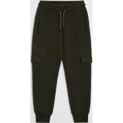 Mango Kids - Spodnie dziecięce Pete 110-164 cm. Żółte spodnie chłopięce Mango Kids, bez wzorów, z bawełny. Za 69,99 zł.