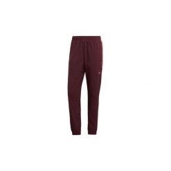 Spodnie treningowe adidas Spodnie dresowe Flamestrike. Czerwone spodnie dresowe męskie marki Adidas, s, z dresówki. Za 329,00 zł.
