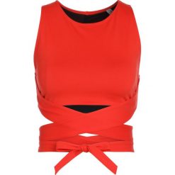 Free People AERIAL CROP Top papaya. Brązowe topy sportowe damskie marki Free People, s, z elastanu. Za 199,00 zł.