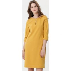 Żółta Sukienka Salome. Żółte sukienki damskie Born2be, xl, bez wzorów, bez kołnierzyka, bez rękawów. W wyprzedaży za 49,99 zł.