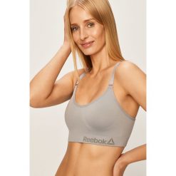 Reebok - Biustonosz sportowy. Fioletowe biustonosze sportowe damskie Reebok, s, z nadrukiem, z elastanu. Za 99,90 zł.