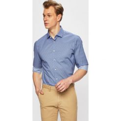 Tommy Hilfiger Tailored - Koszula. Niebieskie koszule męskie Tommy Hilfiger Tailored, bez wzorów, z elastanu, eleganckie, z klasycznym kołnierzykiem, z długim rękawem. W wyprzedaży za 219,90 zł.