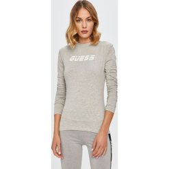 Guess Jeans - Longsleeve. Białe bluzki damskie Guess Jeans, s, z nadrukiem, z bawełny, casualowe, z okrągłym kołnierzem, z długim rękawem. Za 169,90 zł.