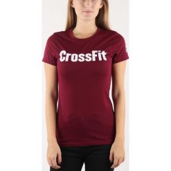 Reebok Koszulka Czerwony. Czerwone topy damskie Reebok, xl, z nadrukiem, z poliesteru, sportowe, bez kołnierzyka. Za 137,95 zł.