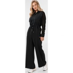 Adidas Originals Kombinezon Czarny. Czarne spodnie damskie adidas Originals, z poliesteru. Za 498,95 zł.