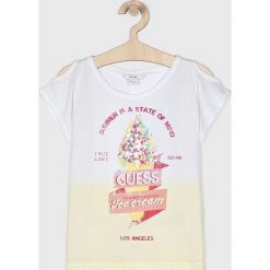 Guess Jeans - Top dziecięcy 118-166 cm. Białe bluzki dziewczęce z nadrukiem, z bawełny, z okrągłym kołnierzem, krótkie. W wyprzedaży za 69,90 zł.