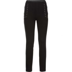 Tregginsy z ćwiekami "bodyshaping" bonprix czarny. Czarne legginsy bonprix. Za 89,99 zł.