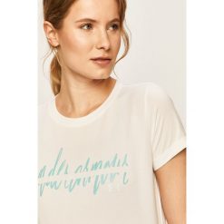 Under Armour - T-shirt. Białe topy damskie Under Armour, s, z nadrukiem, z poliesteru, z okrągłym kołnierzem. Za 149,90 zł.