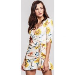 Beżowa Sukienka Periwinkle. Brązowe sukienki damskie other, s, bez wzorów, eleganckie, z dekoltem na plecach, bez rękawów, mini, dopasowane. Za 89,99 zł.