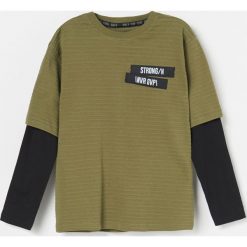Koszulka z podwójnymi rękawami - Khaki. Brązowe koszulki męskie Reserved, m, bez wzorów, z podwójnym kołnierzykiem, bez rękawów. W wyprzedaży za 24,99 zł.