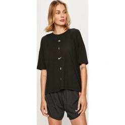 Nike - T-shirt. Czarne topy damskie Nike, s, z nadrukiem, z bawełny, z krótkim rękawem, dri-fit (nike). Za 149,90 zł.