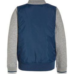 Converse Kurtka przejściowa navy. Czerwone kurtki chłopięce przejściowe marki Converse, z materiału. Za 319,00 zł.